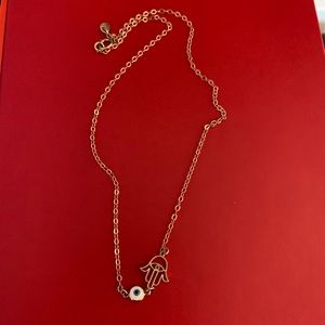Gold hamsa hand with blue evil eye choker necklace